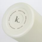 Bottom of a white bottle showing care instructions and capacity in black text.