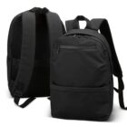 Two black backpacks, one facing front and the other showing the back straps and mesh padding.
