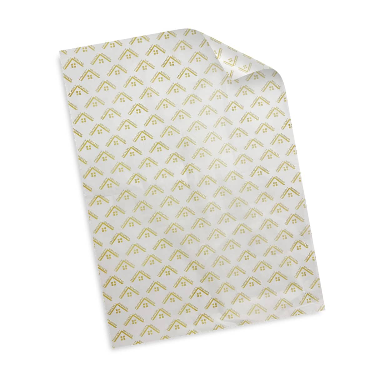 A sheet of transparent wrapping paper with a gold geometric triangle pattern repeating throughout. The paper is slightly rolled at the top right corner, revealing its semi-transparent quality.