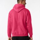 Man wearing a bright pink hooded sweatshirt, viewed from the back against a plain background.