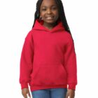 Smiling girl wearing a red hoodie and blue jeans standing against a white background.