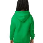 A child in a green hoodie and jeans is standing with their back to the camera.