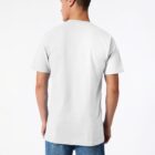 A person wearing a plain white T-shirt and blue jeans is facing away from the camera against a white background. They have short hair and the T-shirt is untucked.
