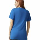 A person with long red hair is wearing a plain blue T-shirt and black pants. They are standing and looking away from the camera, showcasing the back of the T-shirt. The background is plain white.