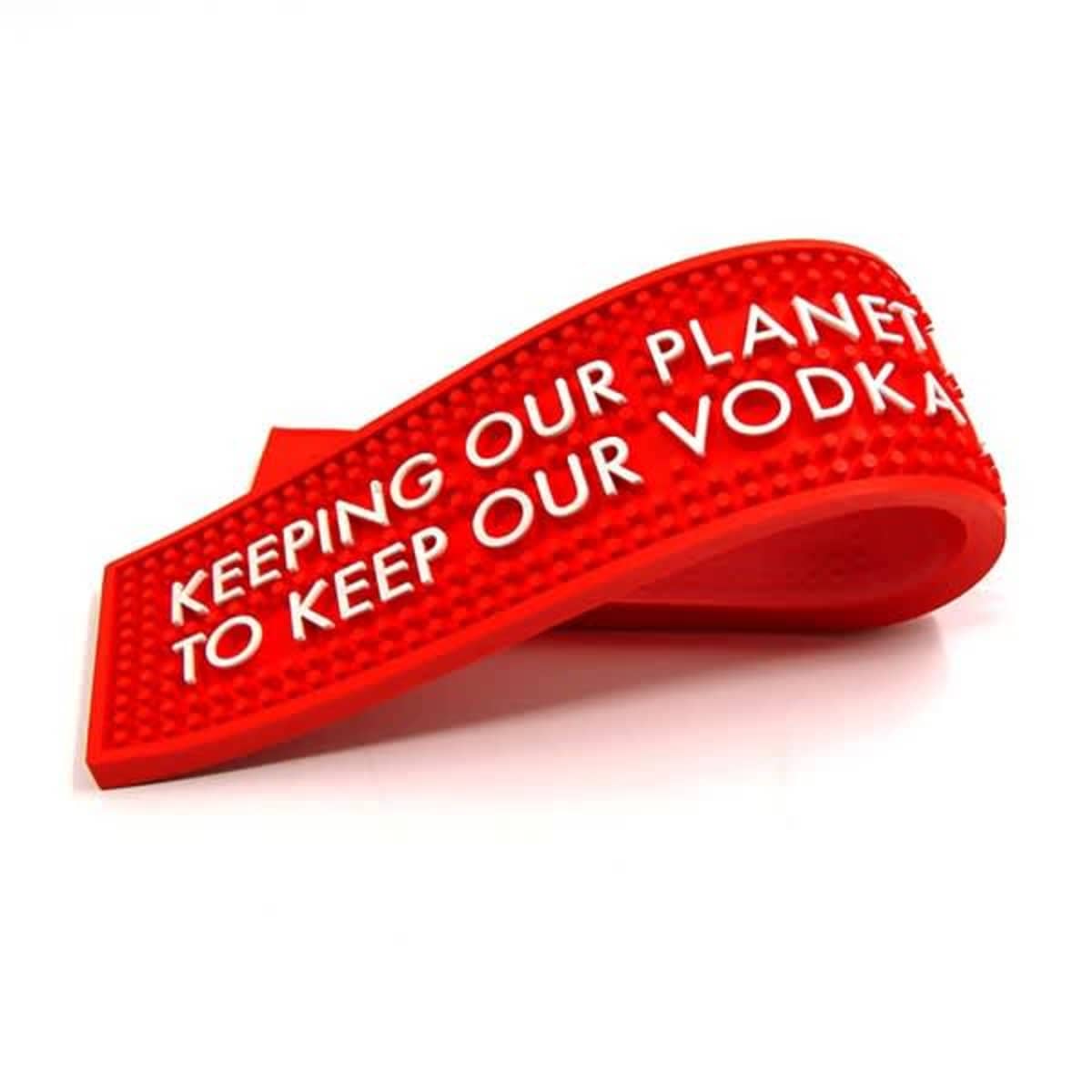 Red rubber bar mat with white text: KEEPING OUR PLANET TO KEEP OUR VODKA.