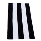Black and white vertical striped rectangular towel laid flat.