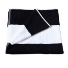 Folded black and white striped towel with one corner turned up.