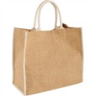 A beige jute tote bag with white handles and trim.
