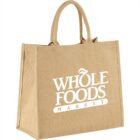 Reusable jute bag with Whole Foods Market logo in white.