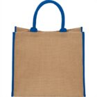 A tan tote bag with blue handles and edges.