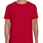 A person wearing a plain red T-shirt and dark jeans stands facing the camera. The T-shirt is short-sleeved with a round neckline. The background is plain white.
