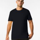 A person wearing a plain black t-shirt stands against a white background. The individual has short dark hair and a neutral expression, with hands at their sides.