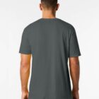 A man with short hair is standing with his back to the camera, wearing a dark green T-shirt and black pants. The background is plain white.