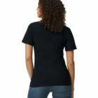 Woman with curly hair wearing a black t-shirt and jeans, seen from the back.