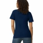 Woman with curly hair wearing a navy t-shirt and jeans, seen from the back.