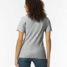 Person with curly hair wearing a gray t-shirt and jeans, shown from the back.