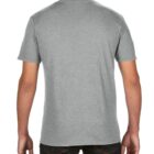 A person is standing with their back to the camera, wearing a plain gray T-shirt and dark jeans.