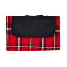Red and black tartan blanket, folded and secured with a black flap.