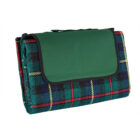 Folded picnic blanket with a green cover and plaid pattern on a white background.