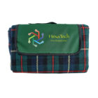 Folded tartan blanket with HexaTech Photographic and colorful logo on the cover.