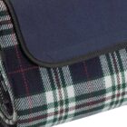 Folded plaid fabric with a blue cover flap.