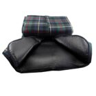 Folded and unfolded tartan-patterned picnic blanket with waterproof backing.