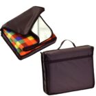 Folded colorful picnic blanket in a black zippered carrying case with a handle.