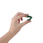 Hand holding a green number 7 keychain.
