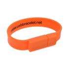 Orange USB bracelet with website text, folded in a loop.