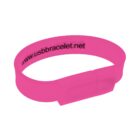 Pink USB bracelet with printed website URL text on its surface.