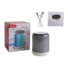 Wireless speaker with box, USB cable, and instruction manual.