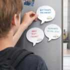 Person reading Speech Balloon Custom Sticky Notes 88Mm X 77Mm with reminders on the fridge.