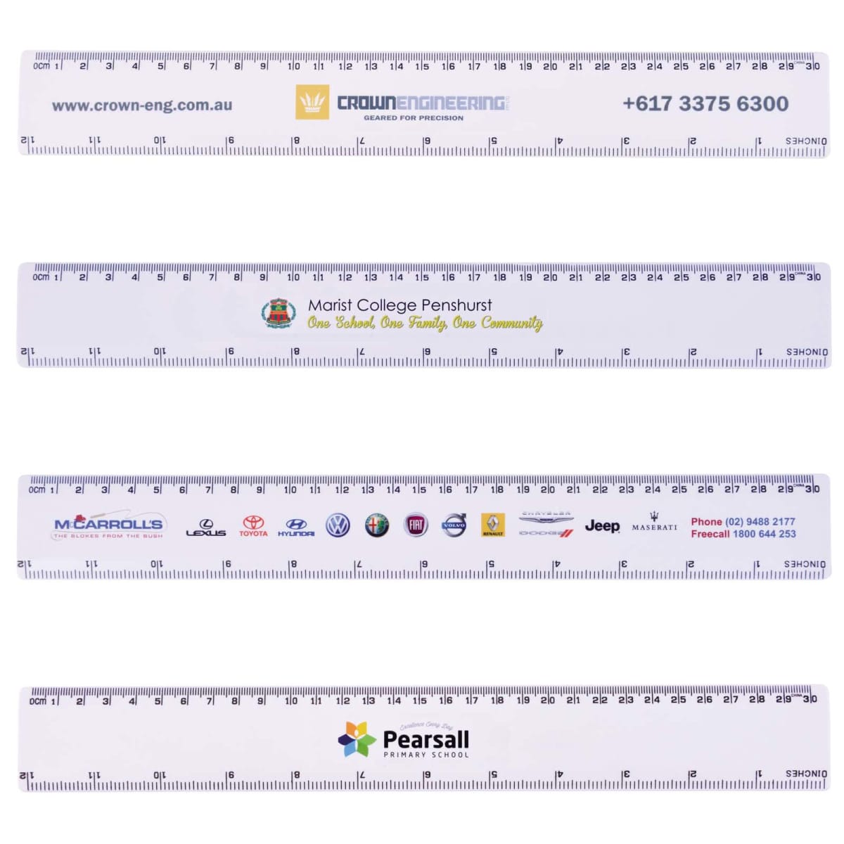 Four white plastic rulers, each with different company logos, phone numbers, and website URLs printed on them. The rulers display both centimeters and inches along the edges. Each ruler showcases distinct branding and logos.