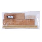 A transparent plastic pouch containing a wooden ruler, a rectangular wooden block, a cylindrical wooden stick, and a metal pencil sharpener.