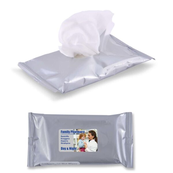 A silver pack of antibacterial wet wipes, partially opened with one wipe protruding. The package features a label depicting a woman holding a baby, with text including Family Pharmacy and Day & Night.