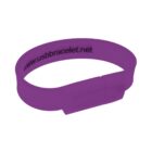 Purple USB bracelet with a website address printed inside.