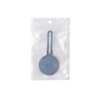 Gray circular keychain in a transparent plastic pouch.