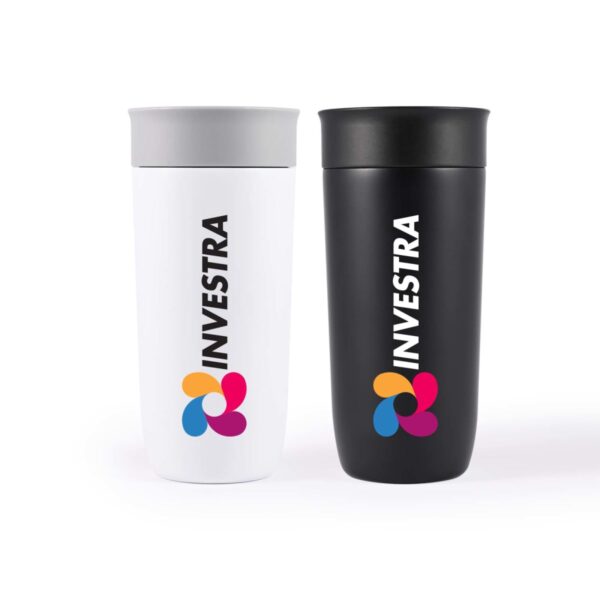 Two travel mugs stand side by side. The left mug is white with a gray lid, and the right mug is black. Both mugs feature the word INVESTRA and a colorful logo consisting of four overlapping petals in pink, orange, blue, and purple.
