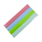 Four rectangular magnetic bars arranged parallel to each other in a row, each in different colors: pink, blue, green, and light blue, on a white background.