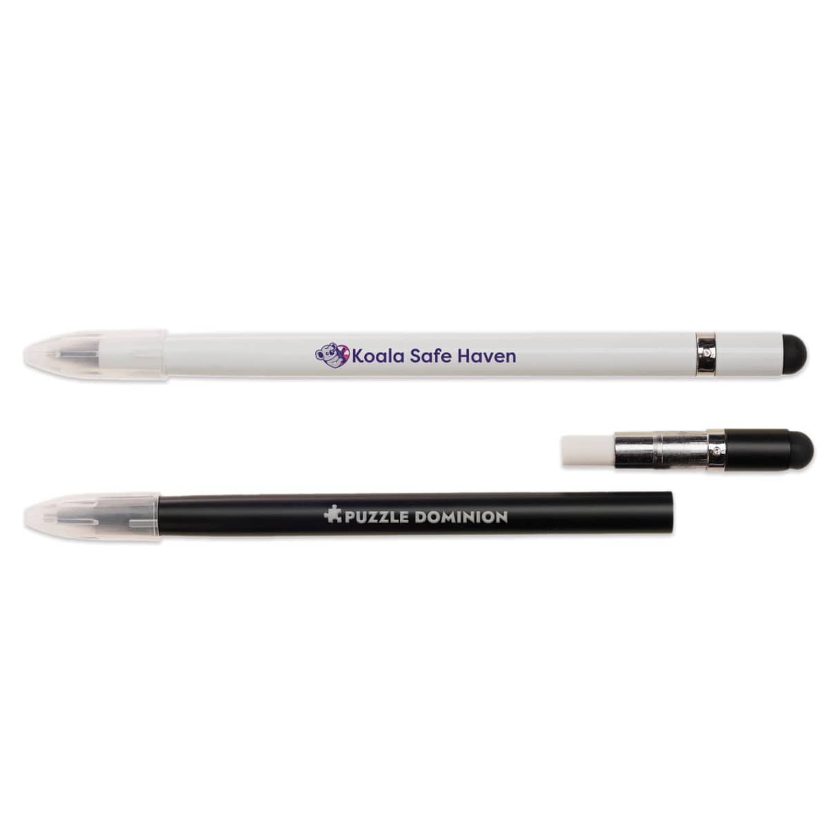 Two stylus pens on a white background. The top pen is white with a Koala Safe Haven logo and a clear cap. The bottom pen is black, labeled Puzzle Dominion, with its cap off, showing the stylus tip.