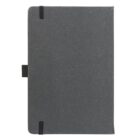A closed black notebook with a textured cover. It has a black elastic band on the bottom left and top right corners and a loop for a pen on the left side.