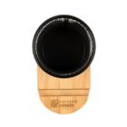 Black cup on a bamboo holder with Creative Corner logo, viewed from above.