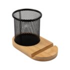 Black mesh pen holder with a bamboo base and a shallow groove in front.