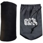 A black rolled-up fleece blanket is next to a gray drawstring bag. The bag features the white text pure earth with a small leaf design.