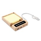 Wooden USB hub with sticky notes and USB cord.