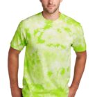 Man wearing a green tie-dye shirt and blue jeans against a white background.