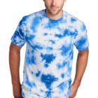 Man wearing a blue and white tie-dye shirt with jeans.
