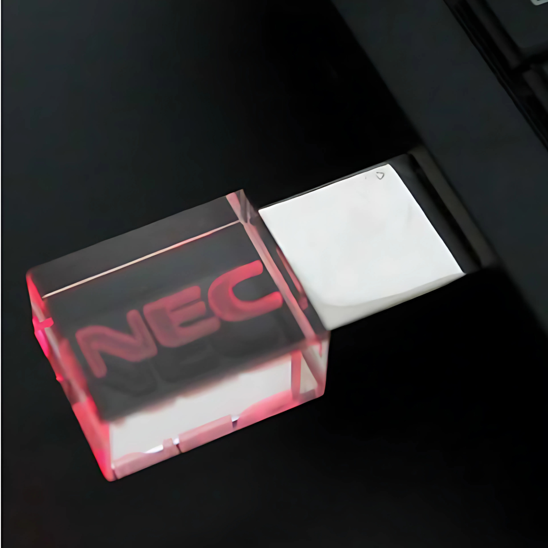 The Illuminator: USB drive with transparent casing and a red glowing NEC inside.