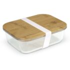 A rectangular glass food container with a bamboo lid secured by a white silicone band.