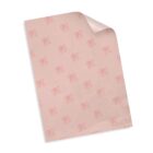 A sheet of light pink wrapping paper with a repeating pattern of BB in red cursive letters, accompanied by the word Bakery beneath each BB. The top right corner of the paper is slightly curled.